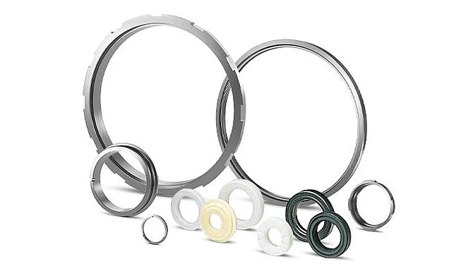 Sealing components for industrial pumps on white background