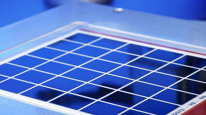 A blue metallised substrate is being machined.